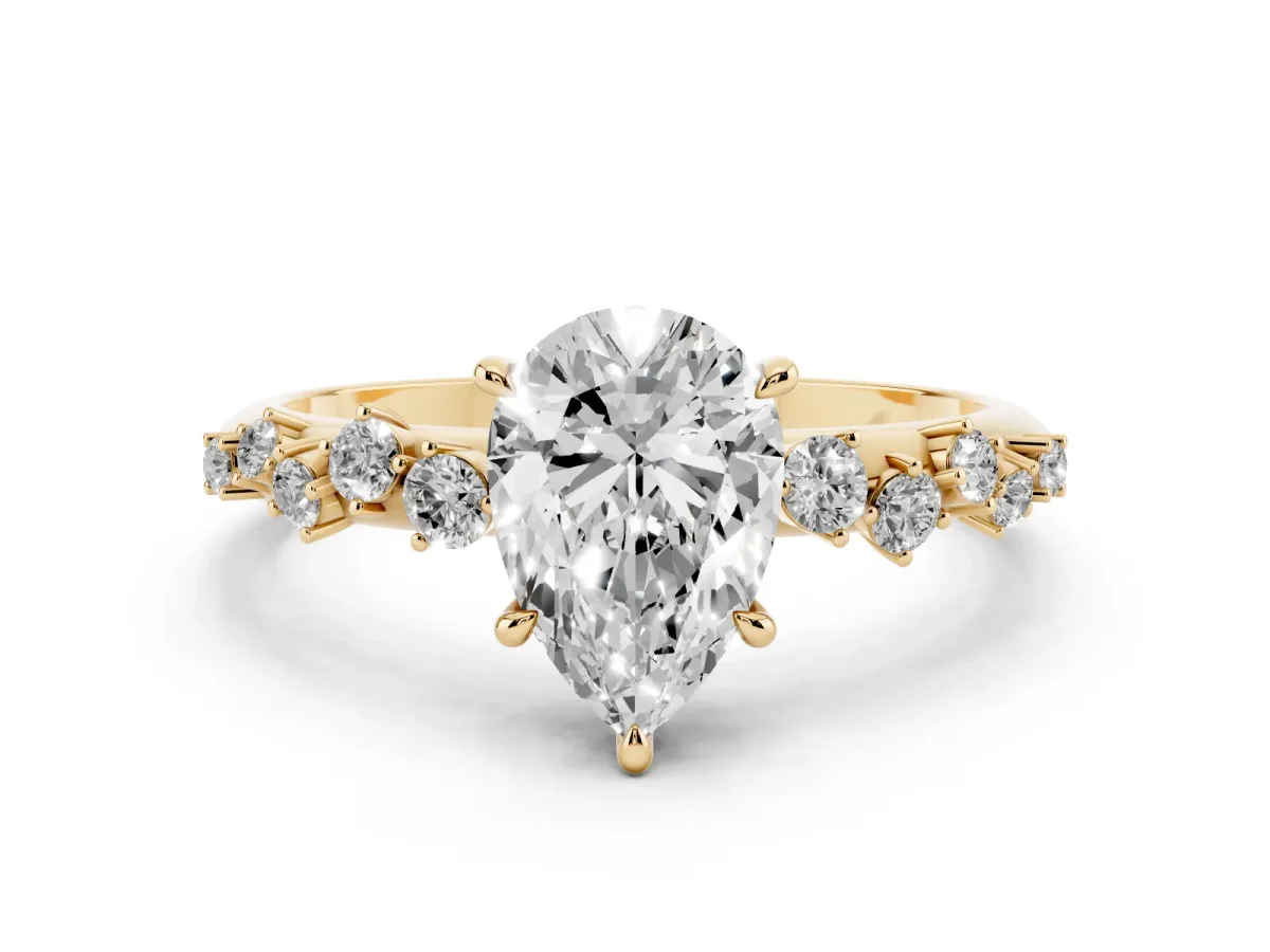 Pear Cut Diamond Cluster Side Stone Solitaire Ring with Prong Setting Yellow gold