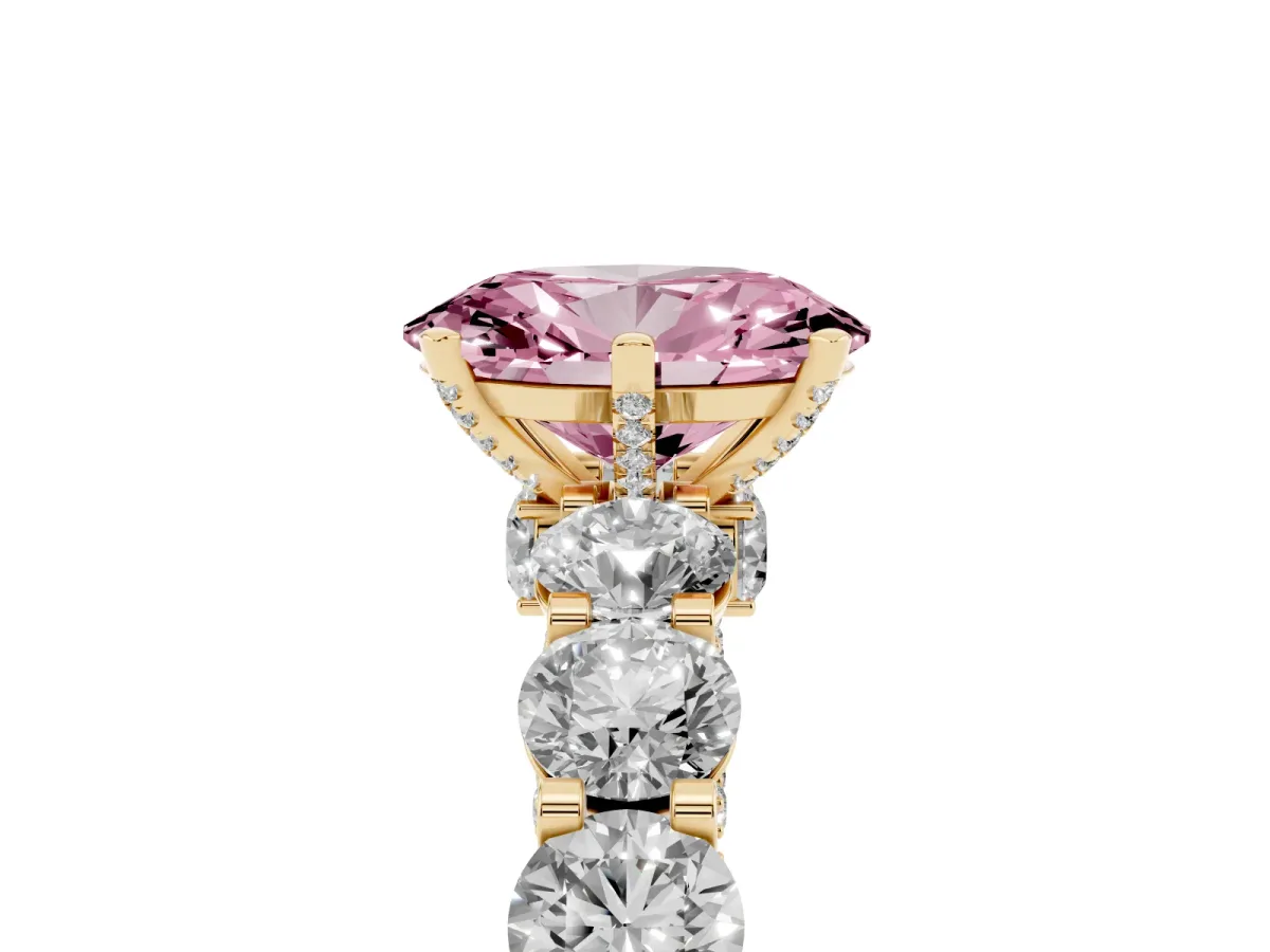 Fancy Pink Oval Cut Diamond Side Stone Engagement Ring with Four-Prong Setting Yellow gold
