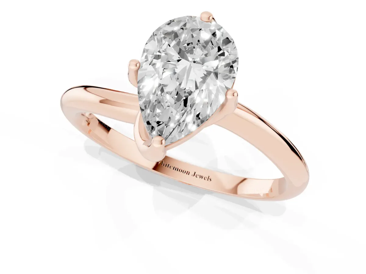 Pear Cut Diamond Solitaire Engagement Ring with Four-Prong Setting and Classic Band Rose gold