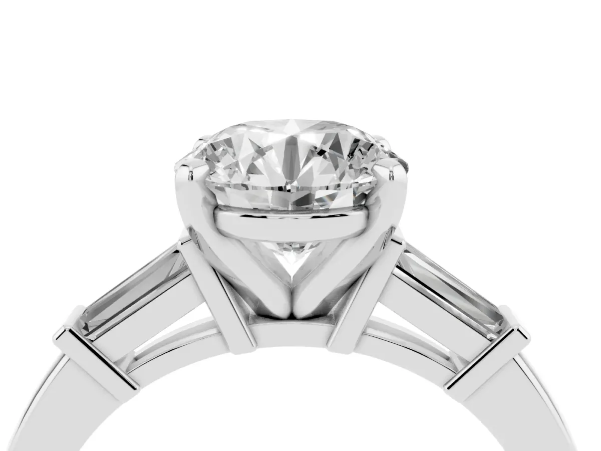 Round Cut Cut Diamond Solitaire Ring with Tapered Baguette Accents and Four-Prong Setting White gold