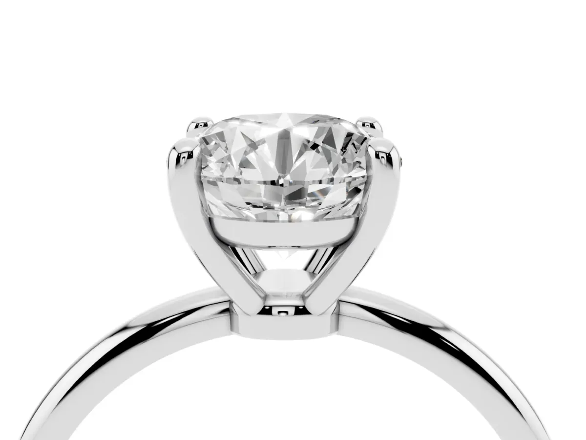 Round Cut Solitaire Diamond Ring with 4-Prong Setting on a Classic Band Platinum