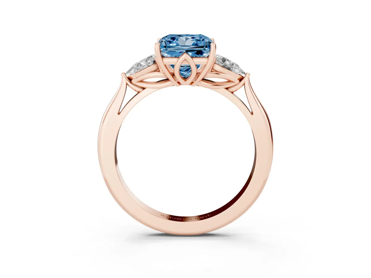 Fancy Blue Three-Stone Princess Cut Diamond Ring with Pear Side Stones in Four-Prong Setting Rose gold