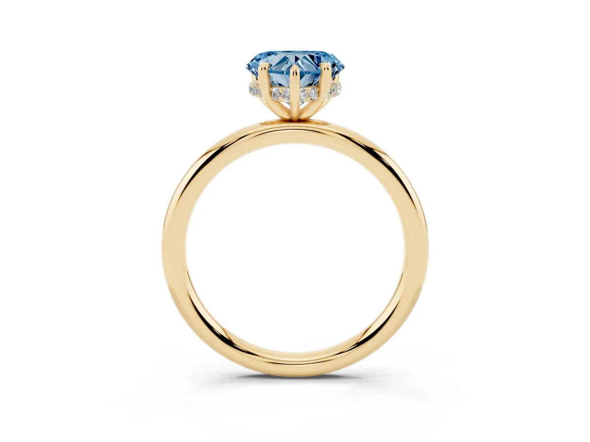 Fancy Blue Heart Cut Diamond Solitaire Ring with Thin Band and Four-Prong Setting Yellow gold