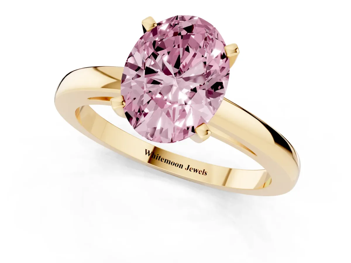 Fancy Pink Oval Cut Solitaire Diamond Engagement Ring with Four-Prong Setting on a Classic Band Yellow gold