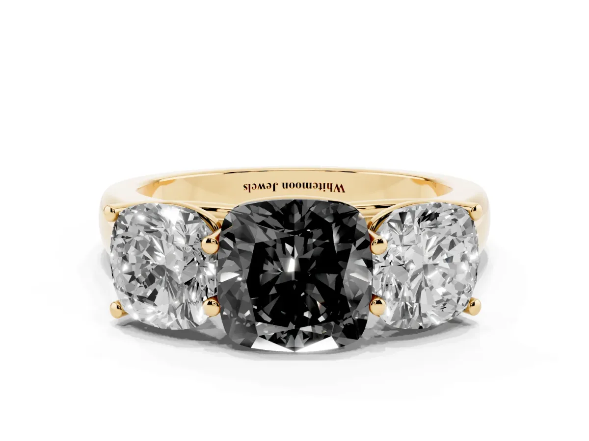 Fancy Black Cushion Cut Three-Stone Diamond Ring with Prong Setting on a Classic Band Yellow gold