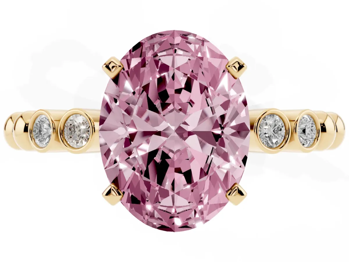 Fancy Pink Oval Cut Solitaire Bezel Accent Diamond Engagement Ring with Beaded Band and Four-Prong Setting Yellow gold