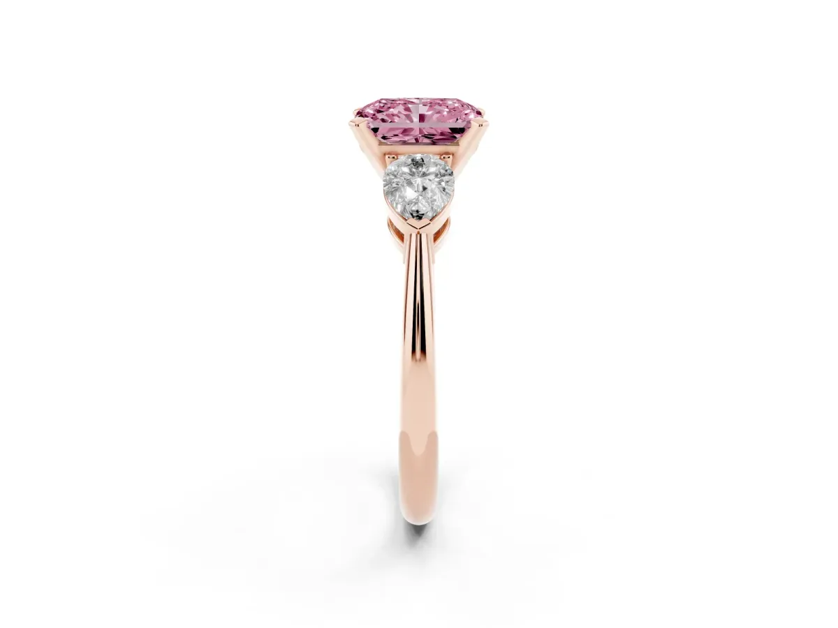 Fancy Pink Three-Stone Radiant Cut Diamond Ring with Pear Side Stones and Four-Prong Setting Rose gold