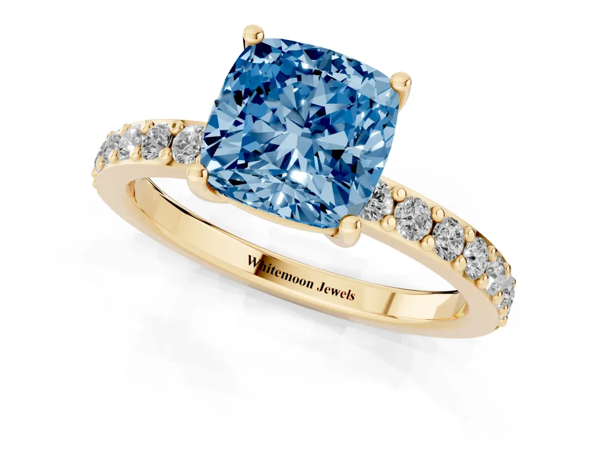 Fancy Blue Cushion Cut Cut Diamond Solitaire with Pave Band and Four-Prong Setting Yellow gold
