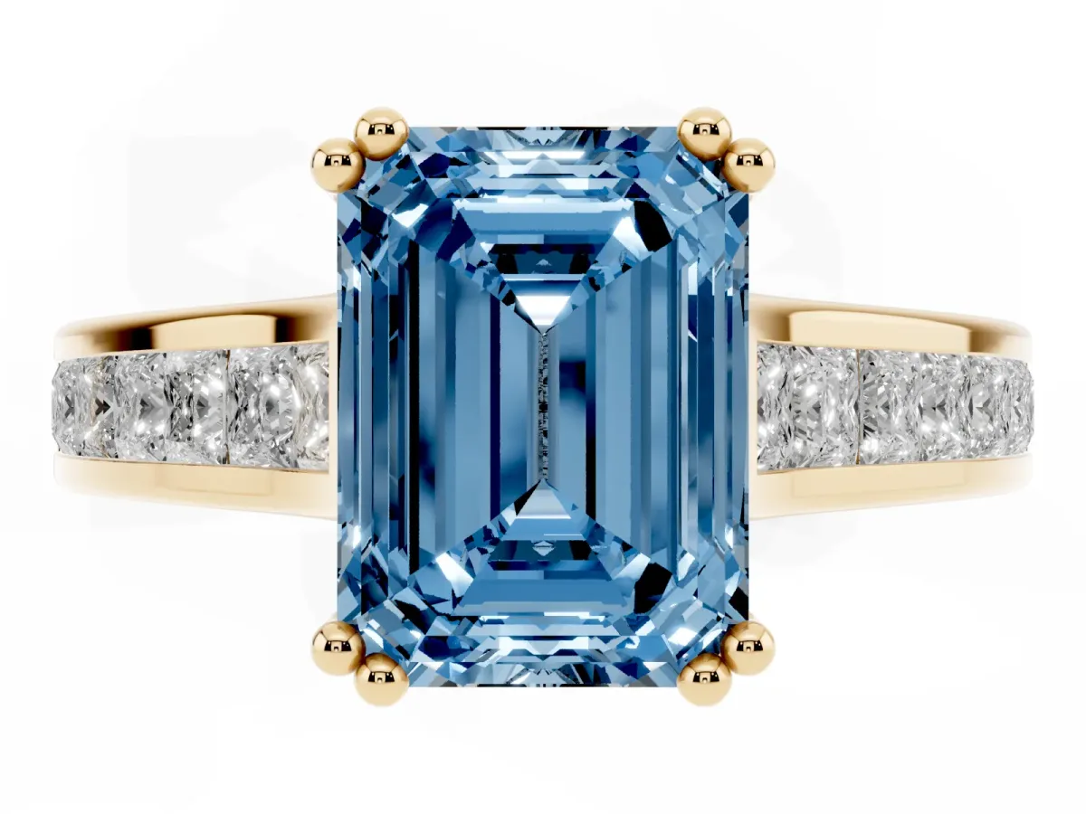 Fancy Blue Emerald Cut Cut Channel Set Solitaire Engagement Ring with Prong Setting Yellow gold