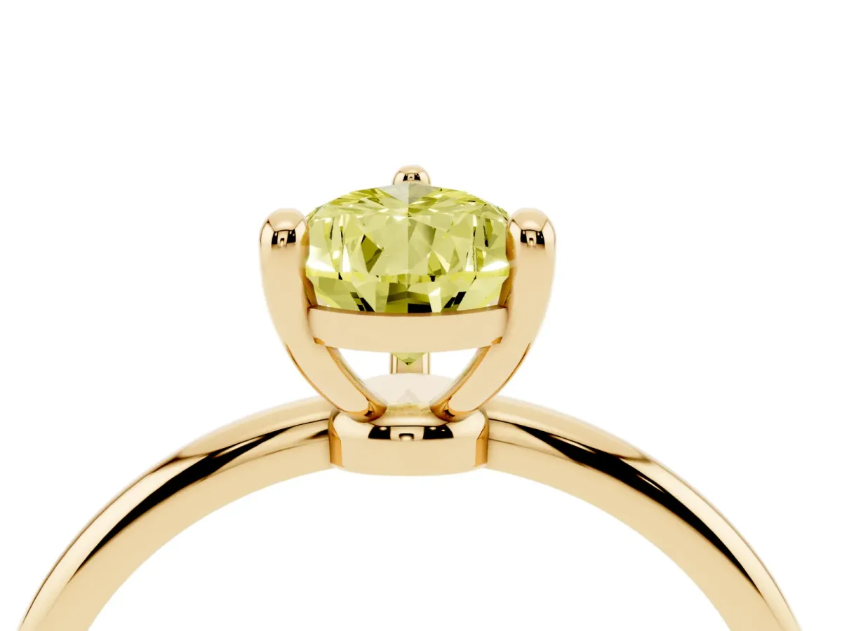Fancy Yellow Pear Cut Solitaire Diamond Ring with 4-Prong Setting on a Classic Band Yellow gold