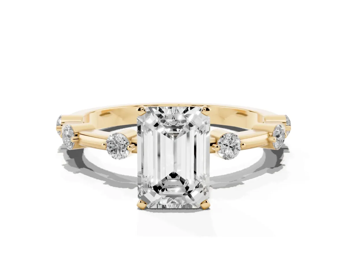 Emerald Cut Solitaire Diamond Ring with Bezel Set Side Stones and Prong Setting Yellow gold