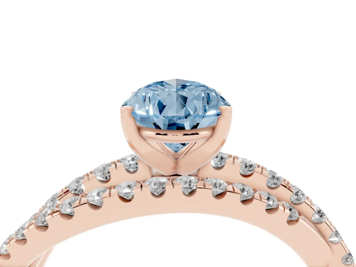 Fancy Blue Pear Cut Solitaire Twist Band with Pavé Setting and Four-Prong Setting Rose gold