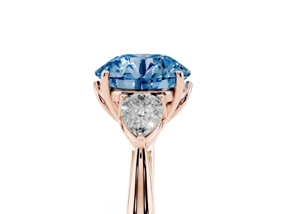 Fancy Blue Three-Stone Round Cut Diamond Ring with Pear Side Stones in Four-Prong Setting Rose gold