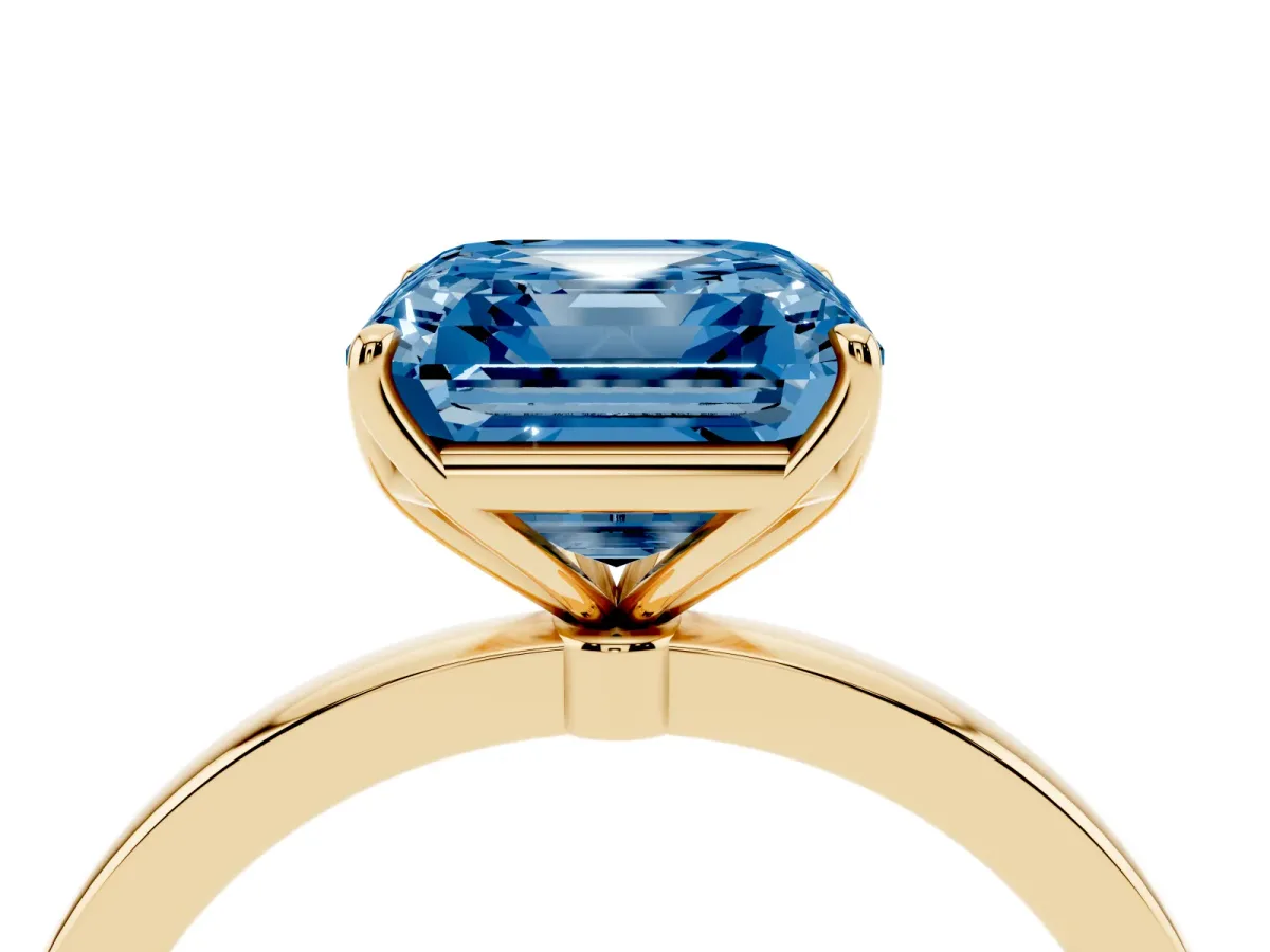 Fancy Blue Asscher Cut Diamond Solitaire Ring with Thin Band and Prong Setting Yellow gold