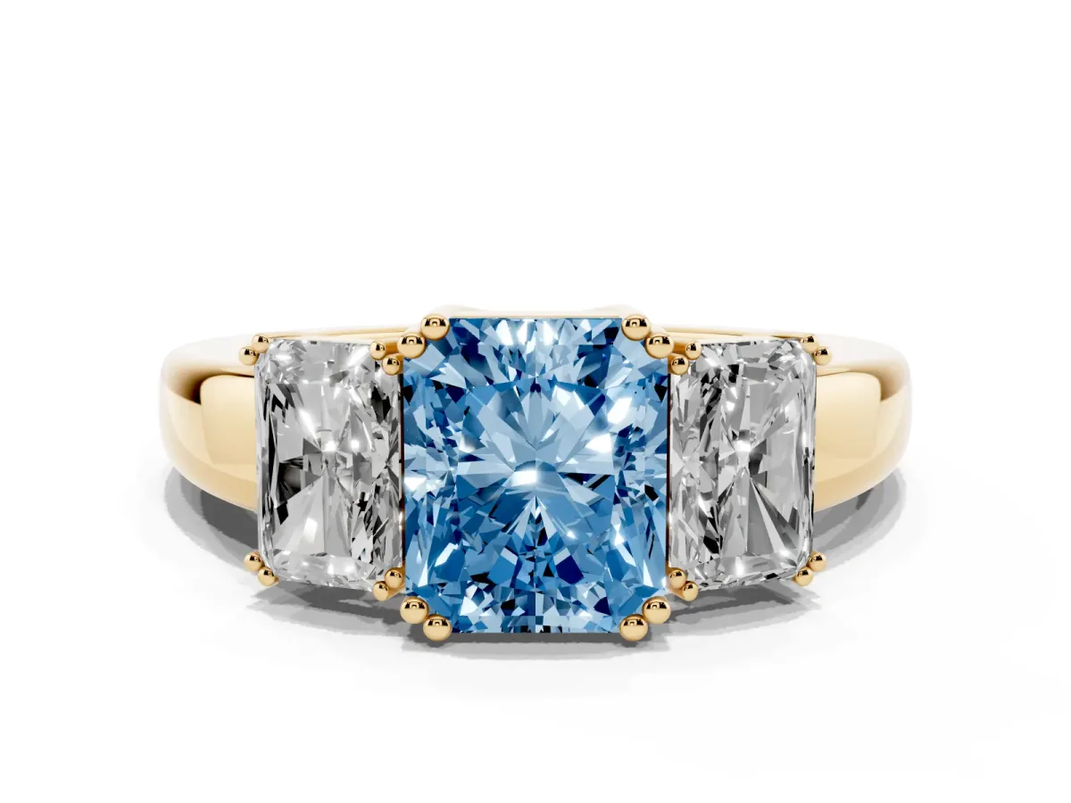 Fancy Blue Three-Stone Radiant Cut Cut Diamond Ring with Channel Set Band and Four-Prong Setting Yellow gold