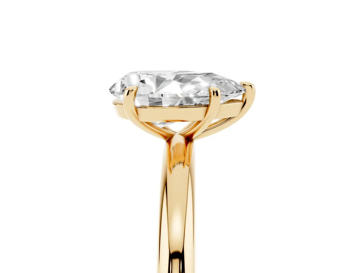 Pear Cut Solitaire Diamond Ring with Four-Prong Setting on a Plain Band Yellow gold
