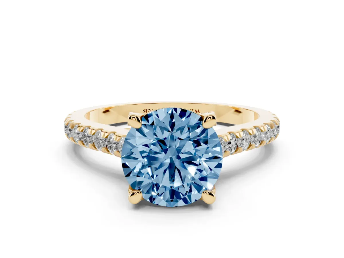 Fancy Blue Round Cut Brilliant Diamond Solitaire with Pavé Band and Four-Prong Setting Yellow gold