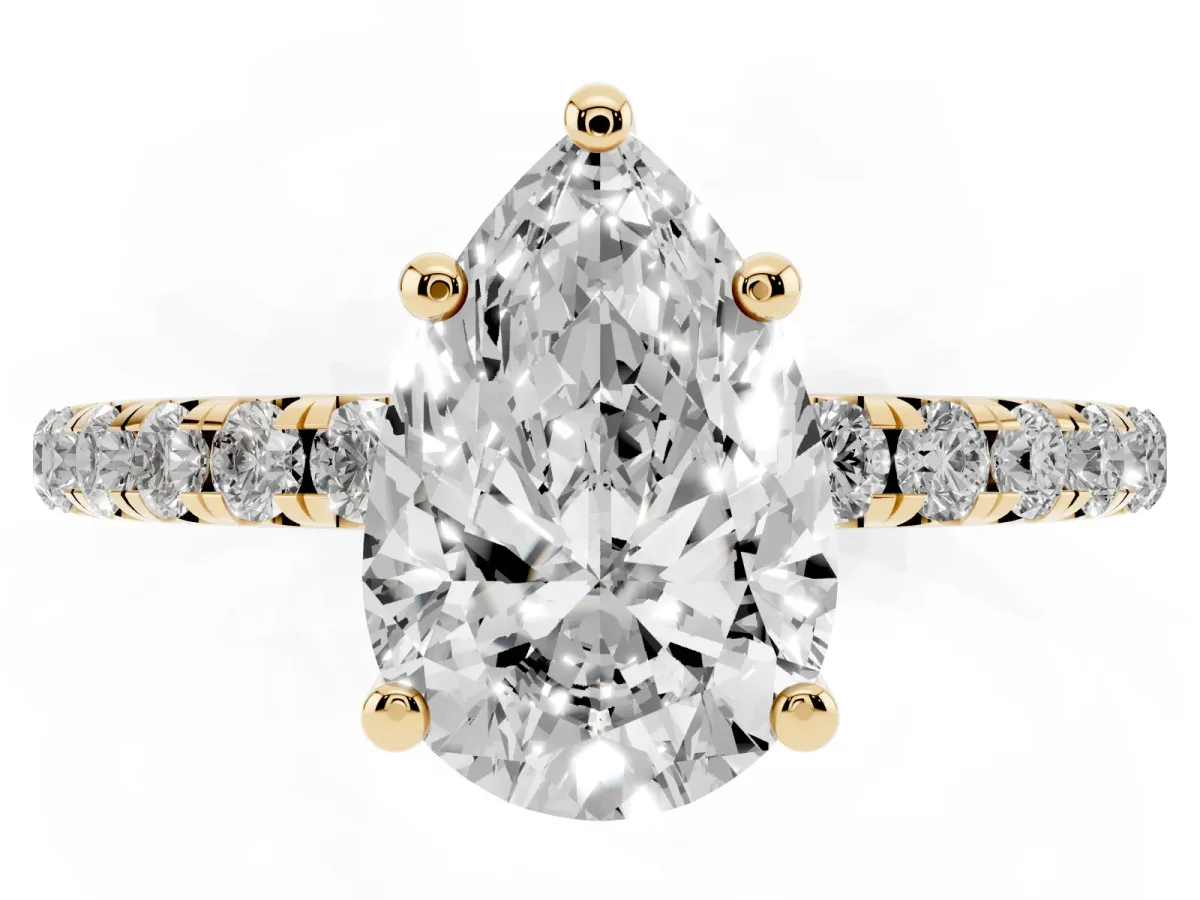 Pear Cut Cut Diamond Solitaire Ring with Micro Pave Band and Four Prong Setting Yellow gold