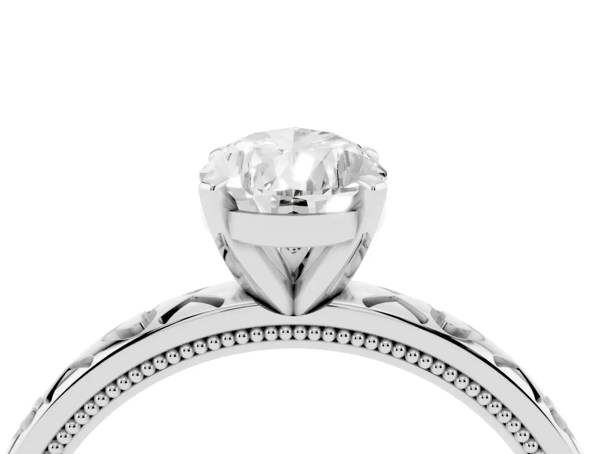 Pear Cut Solitaire Diamond Engagement Ring with XO Engraved Band and Four-Prong Setting White gold