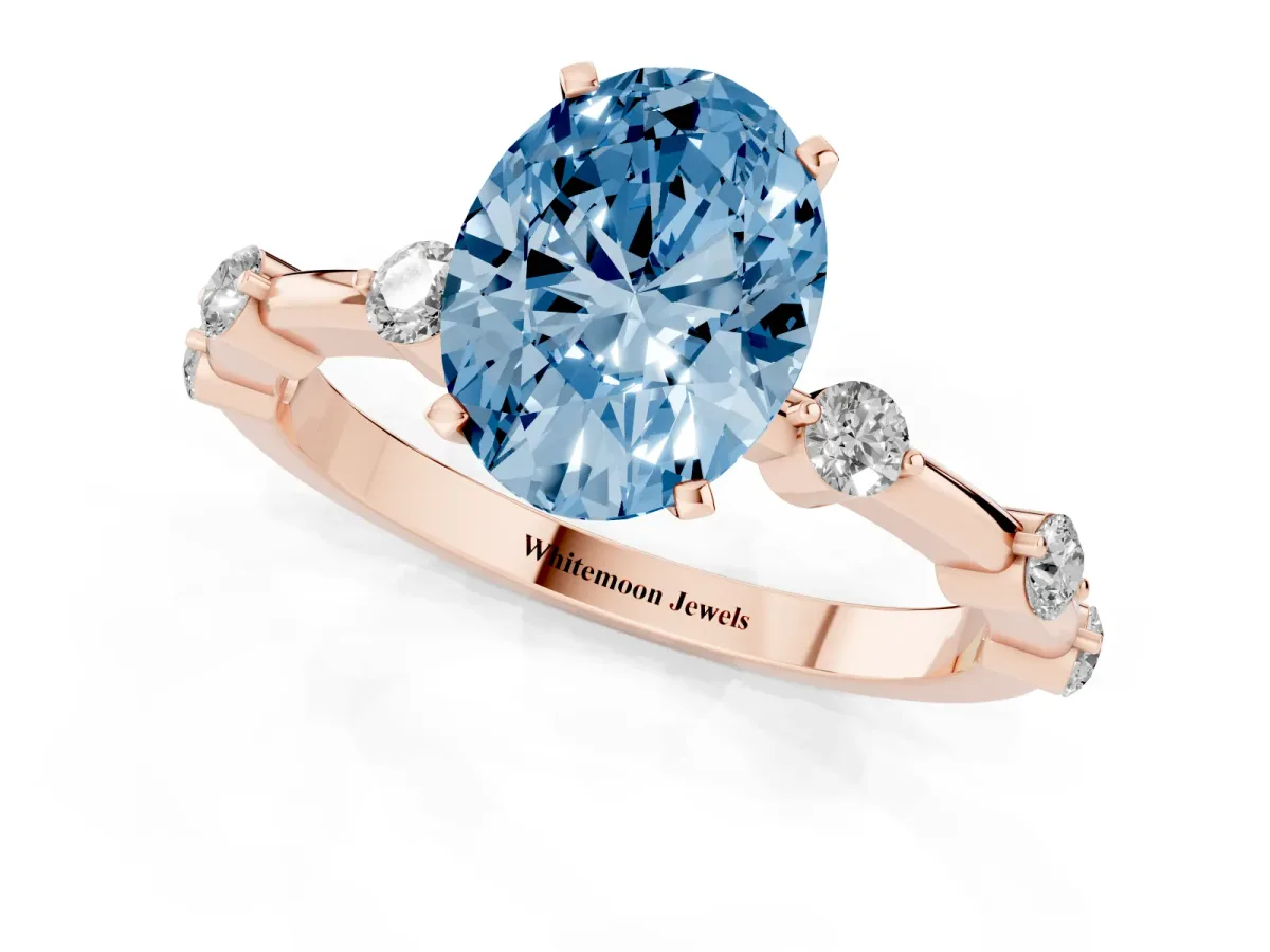 Fancy Blue Oval Cut Solitaire Diamond Ring with Bezel Set Side Stones and Prong Setting Rose gold