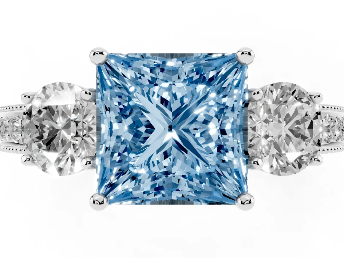 Fancy Blue Princess Cut Three-Stone Diamond Ring with Pavé Band and Four-Prong Setting Silver