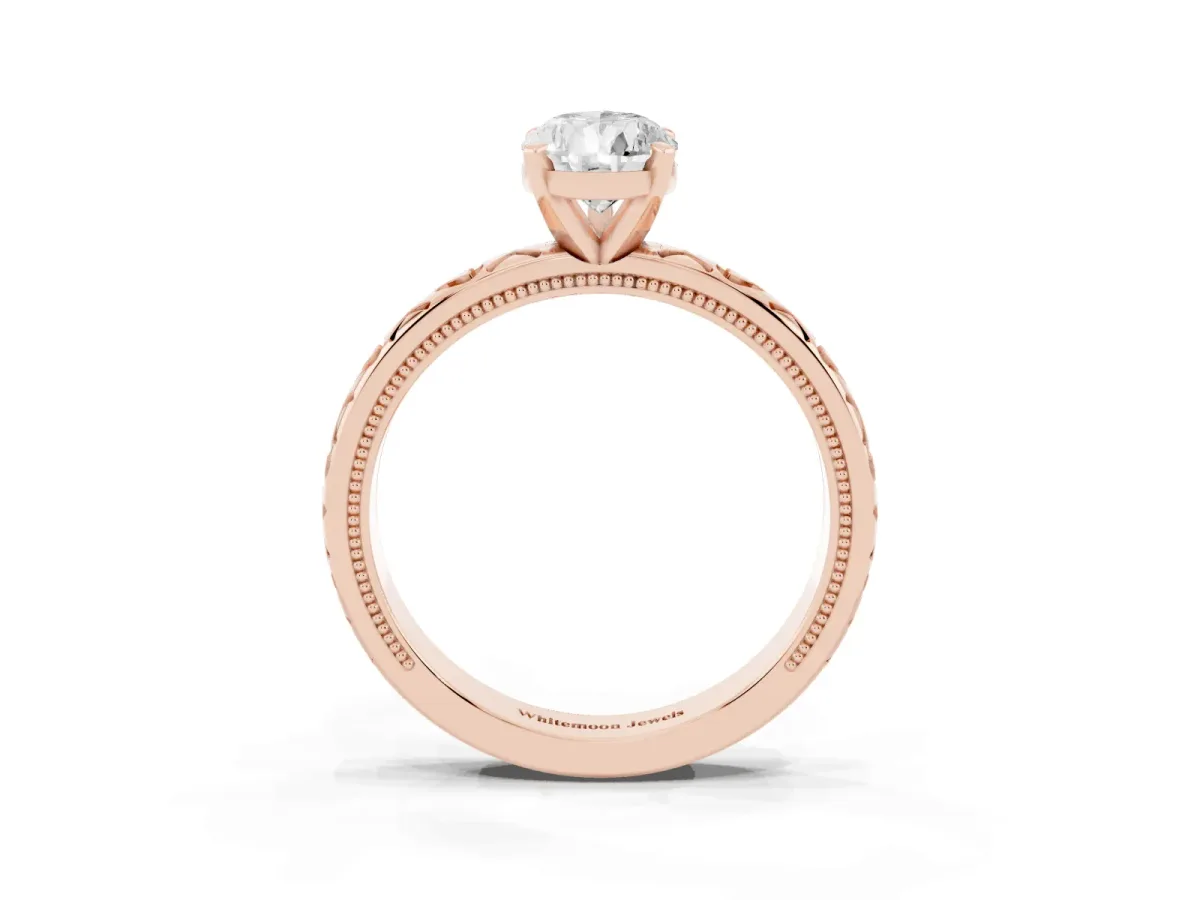 Pear Cut Solitaire Diamond Engagement Ring with XO Engraved Band and Four-Prong Setting Rose gold
