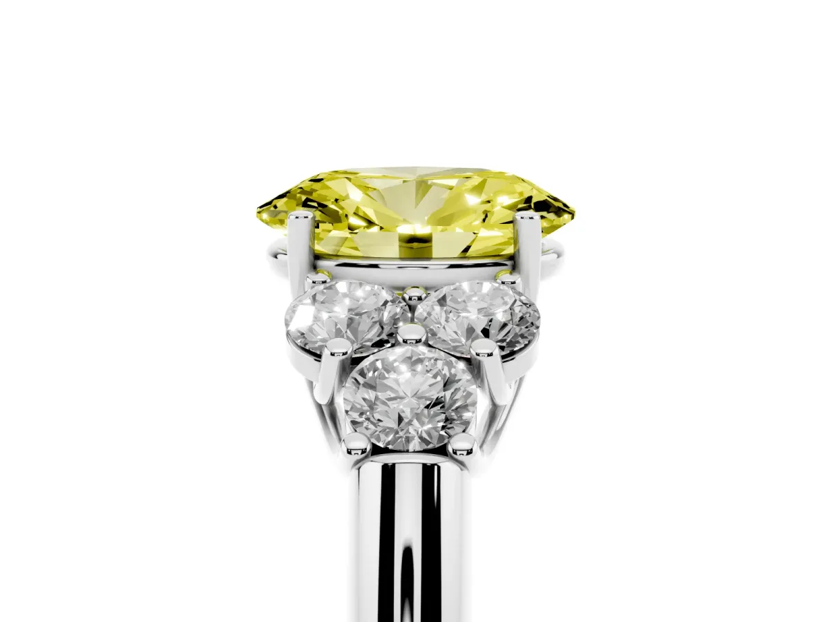 Fancy Yellow Oval Cut Cut Diamond Cluster Ring with Round Accent Stones and Prong Setting on a Classic Band Platinum