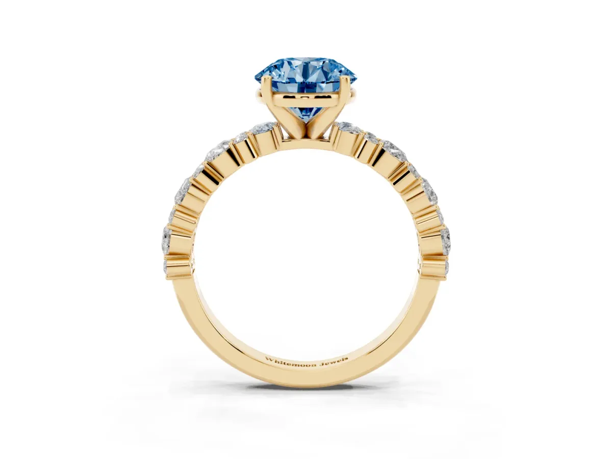 Fancy Blue Round Cut Diamond Side Stone Solitaire Ring with Round and Four-Prong Setting Yellow gold