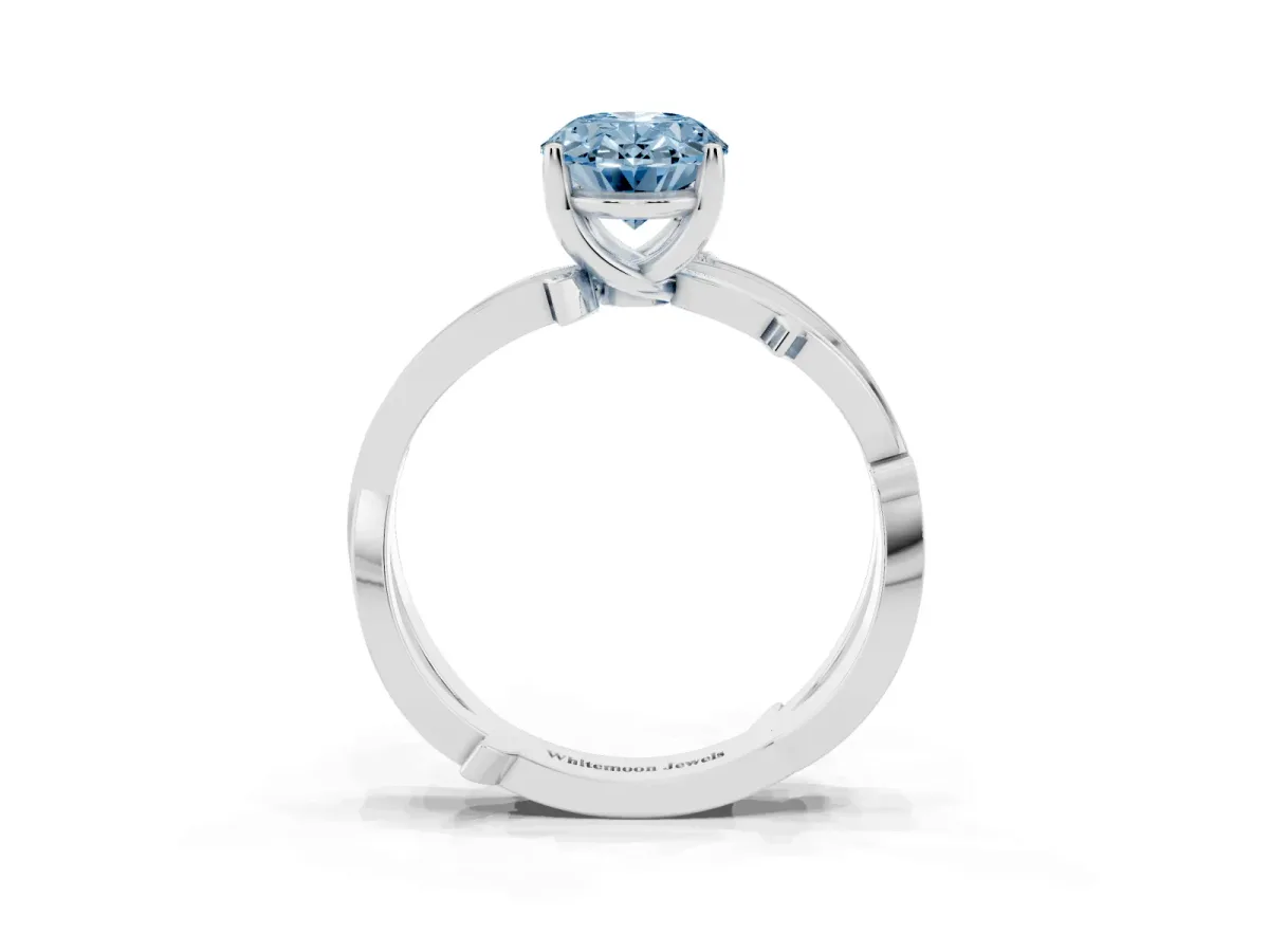 Fancy Blue Oval Cut Solitaire Twist Band with Pavé Accents and Four-Prong Setting White gold
