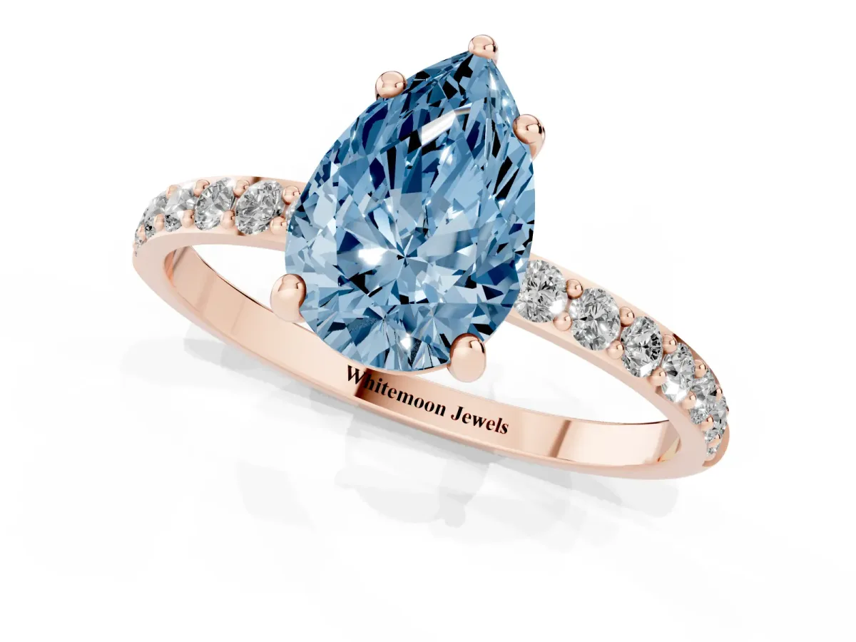 Fancy Blue Pear Cut Diamond Solitaire Ring with Round Pavé Band and Prong Setting Rose gold