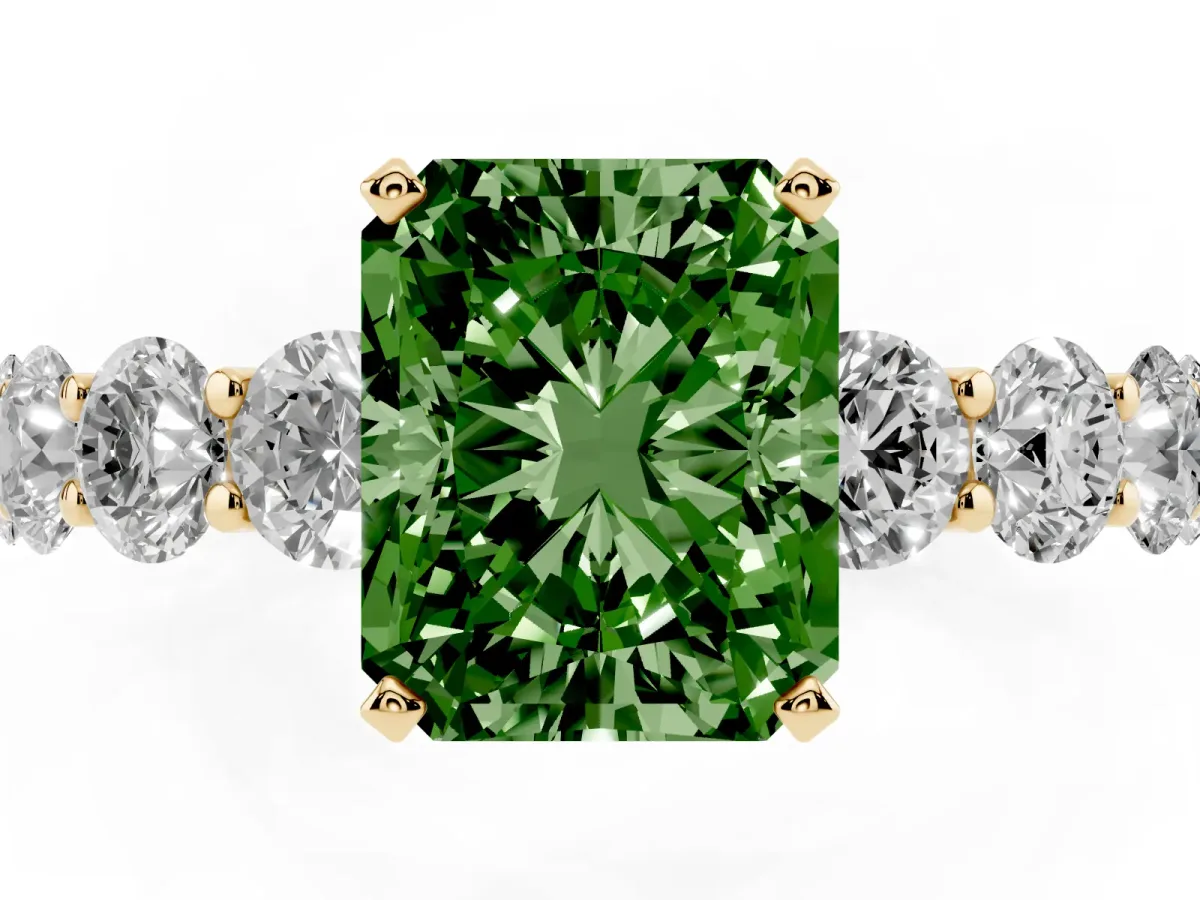 Fancy Green Radiant Cut Diamond Prong Setting with Side Stones on a Pave Band Yellow gold
