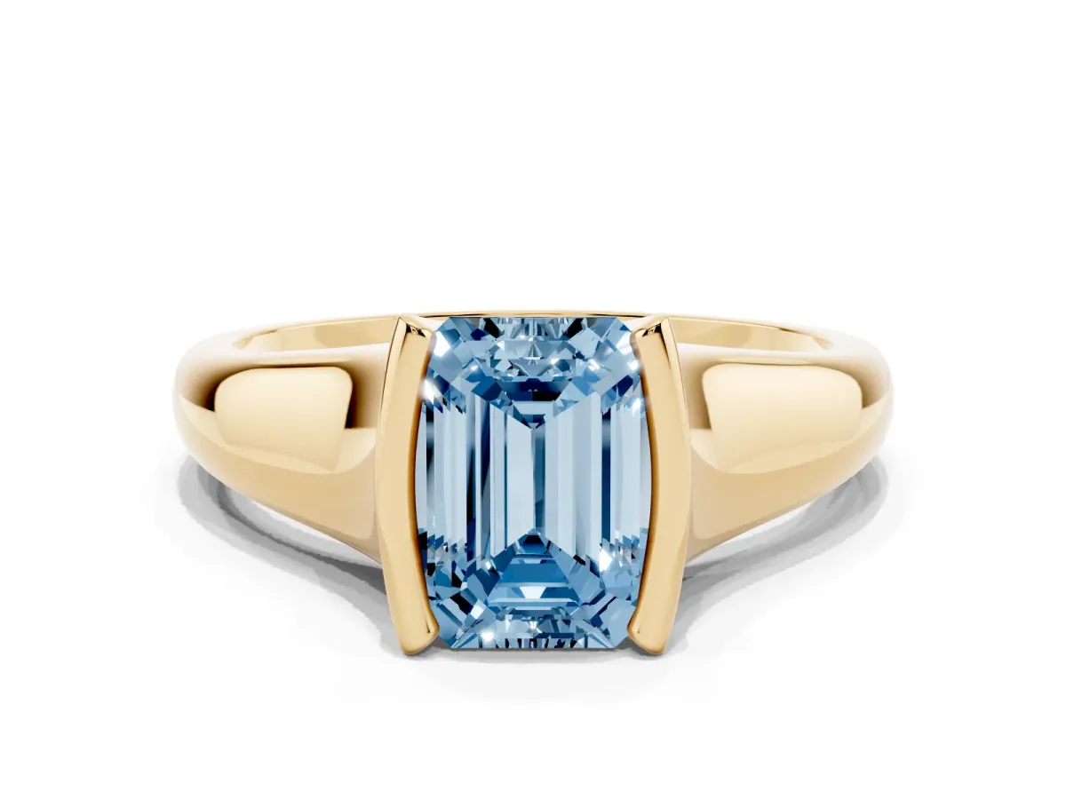 Fancy Blue Emerald Cut Solitaire Tension Set Diamond Ring with Split Shank Band Yellow gold