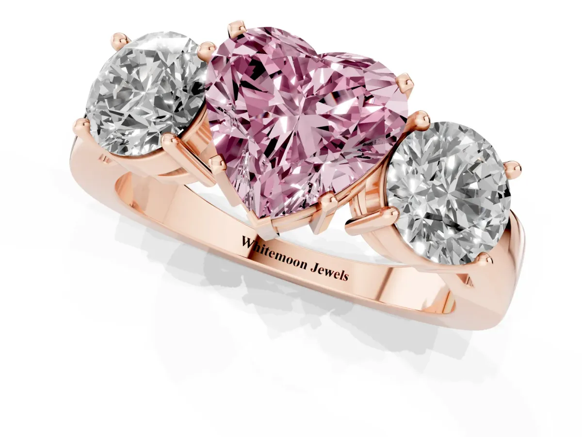 Fancy Pink Three-Stone Heart Cut Diamond Ring with Round Side Stones, Classic Band, and Four-Prong Setting Rose gold