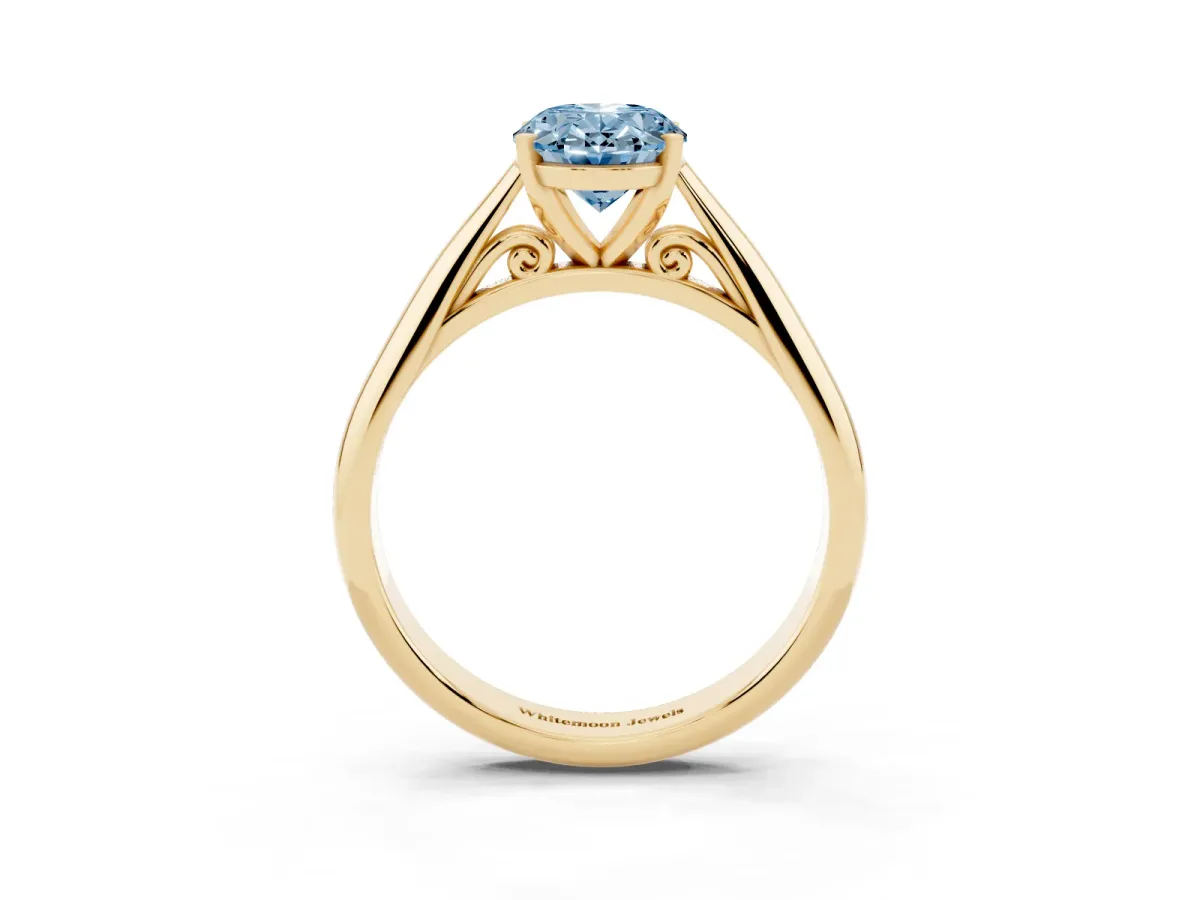 Fancy Blue Oval Cut Diamond Solitaire Engagement Ring with Cathedral Setting and Four-Prong Mount Yellow gold