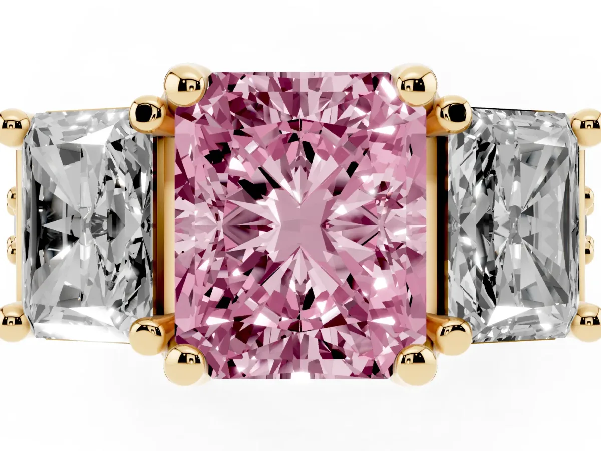 Fancy Pink Radiant Cut Diamond Three-Stone Ring with Channel Set Band and Four-Prong Setting Yellow gold