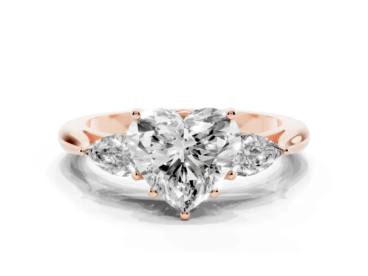 Three-Stone Heart Cut Brilliant Diamond Solitaire Ring with Tapered Band and Four-Prong Setting Rose gold