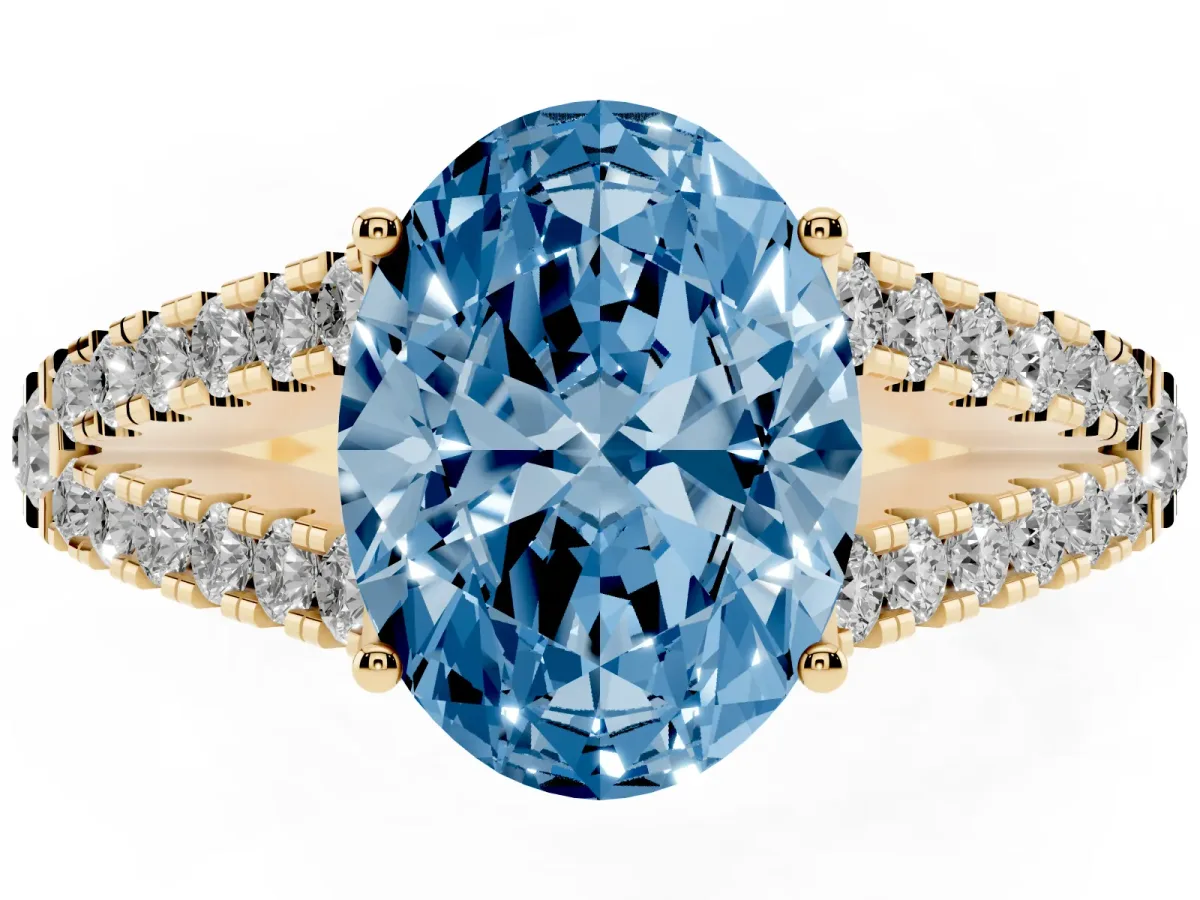 Fancy Blue Oval Cut Diamond Split Shank Engagement Ring with Round Pavé and Prong Setting Yellow gold
