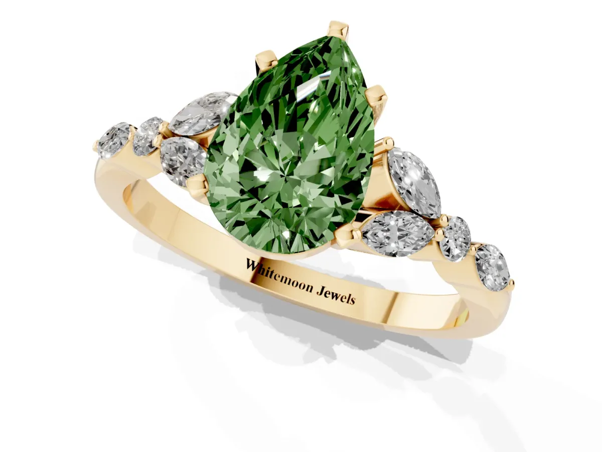 Fancy Green Pear Cut Diamond Solitaire Ring with Side Stones and Four-Prong Setting Yellow gold
