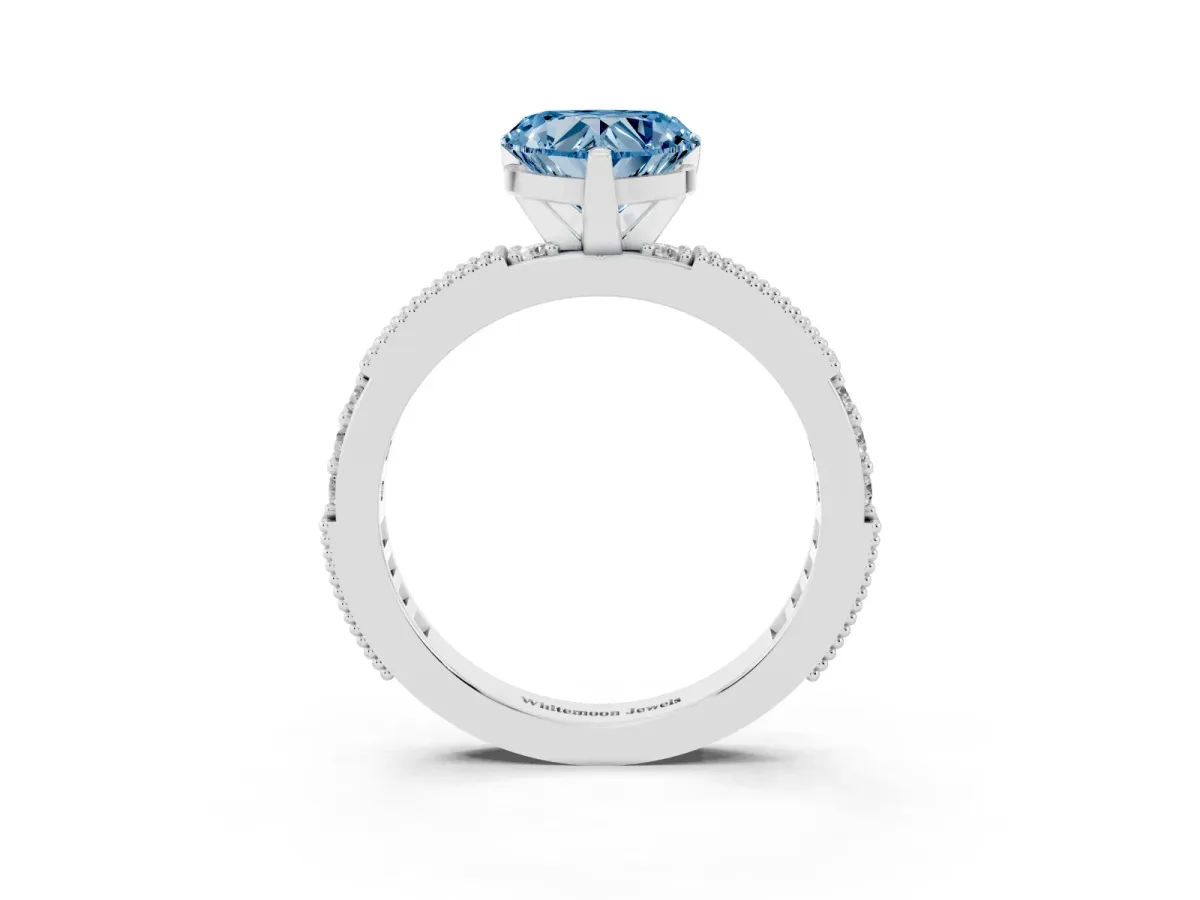 Fancy Blue Heart Cut Solitaire with Pavé Band and Four-Prong Setting Silver
