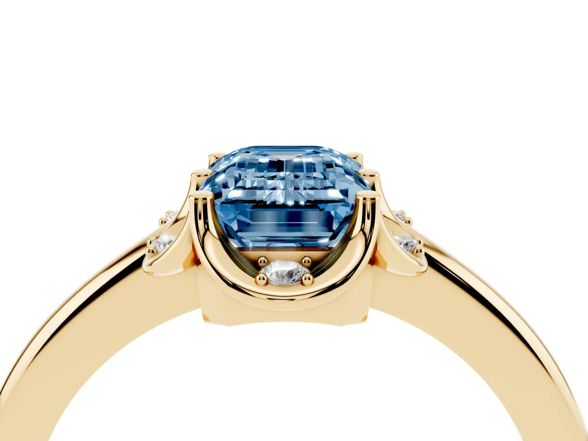 Fancy Blue Emerald Cut Halo Diamond Ring with Round Cluster Setting, Solitaire Band, and Four-Prong Setting Yellow gold