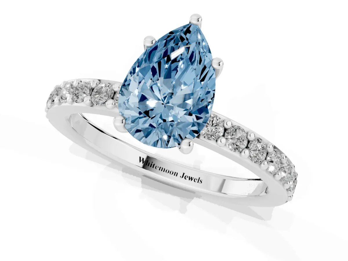 Fancy Blue Pear Cut Cut Diamond Solitaire with Pave Band and Four-Prong Setting Silver
