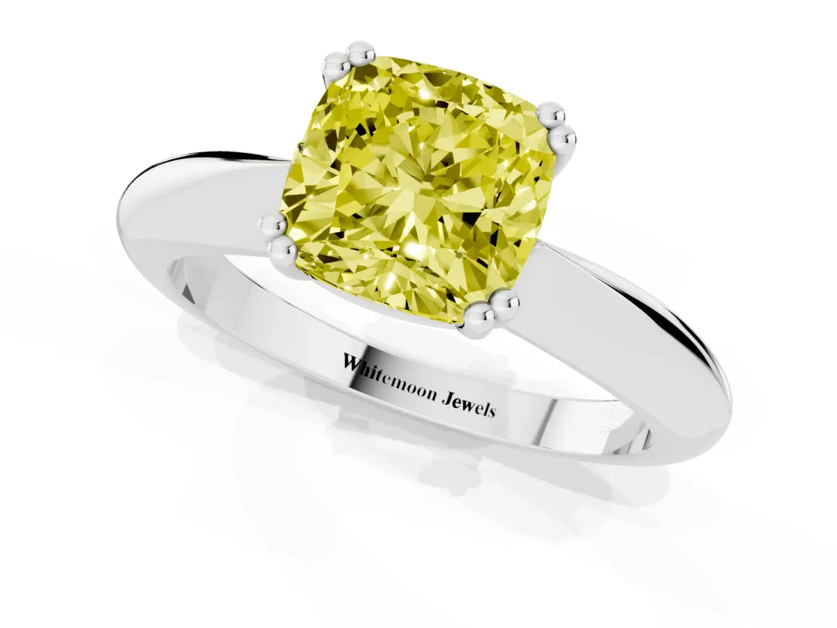 Fancy Yellow Cushion Cut Cut Solitaire Engagement Ring with Tapered Band and Four-Prong Setting Platinum