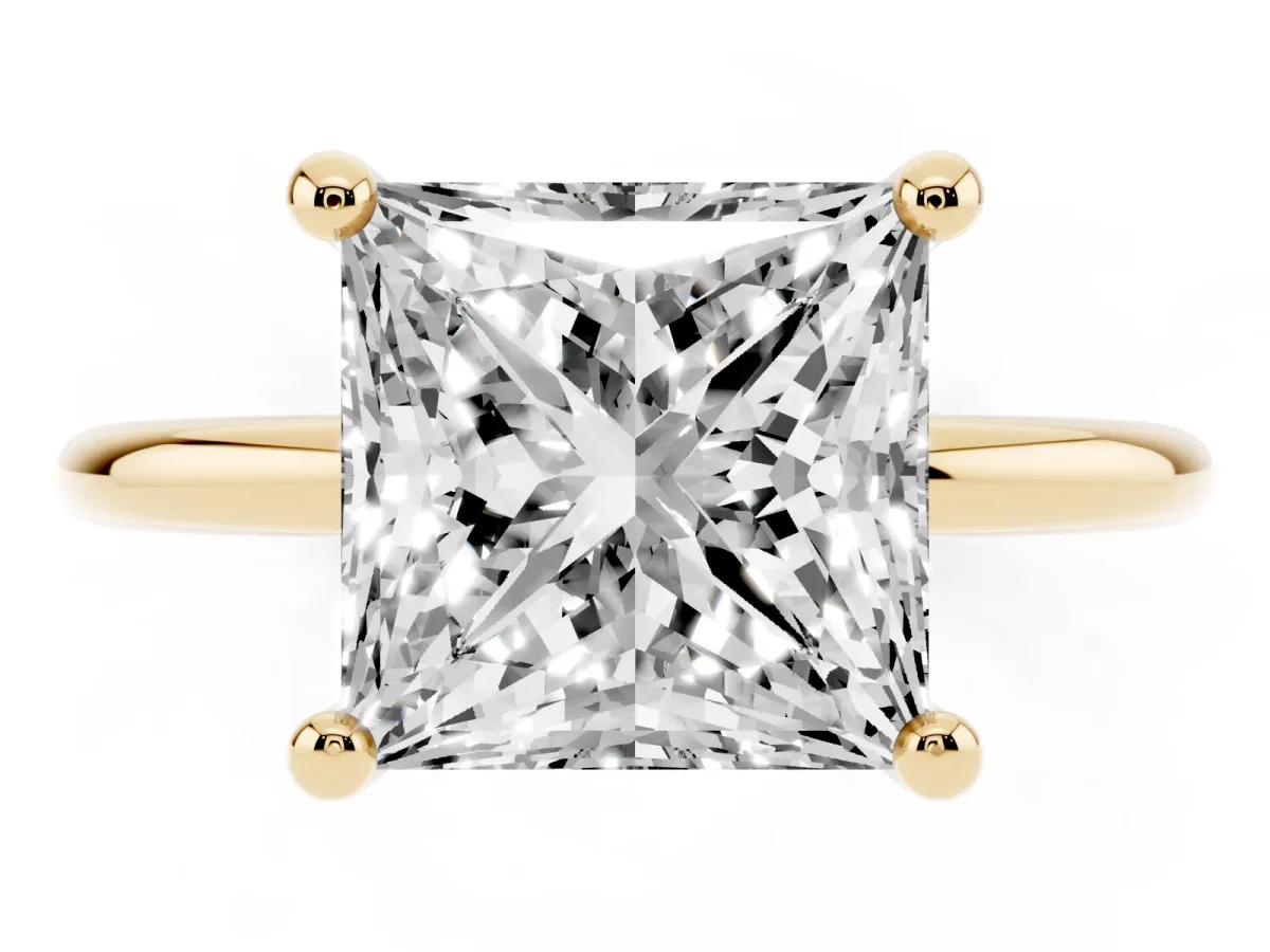 Princess Cut Solitaire Diamond Ring with 4-Prong Setting on a Classic Band Yellow gold