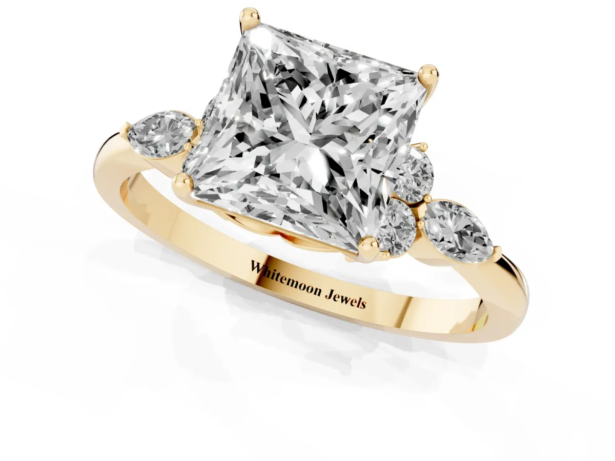 Princess Cut Brilliant Diamond Solitaire Ring with Pear Side Stones and Four-Prong Setting Yellow gold