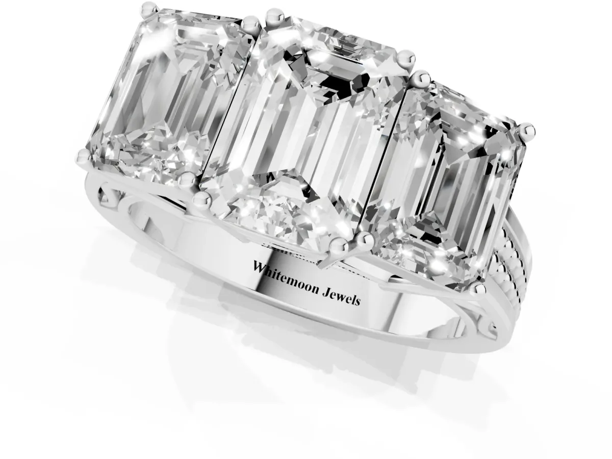 Emerald Cut Diamond Three-Stone Ring with Prong Setting and Textured Band White gold