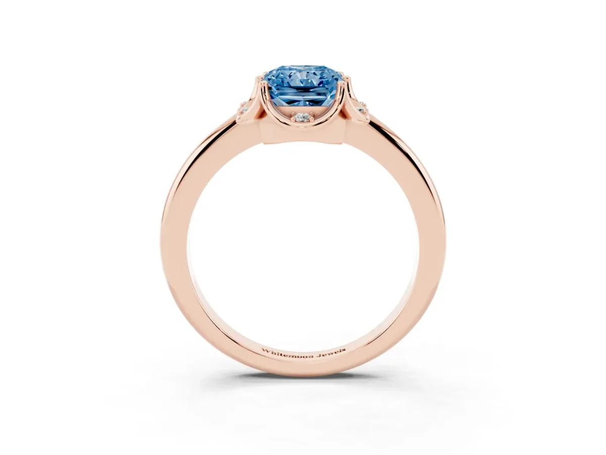 Fancy Blue Radiant Cut Halo Diamond Ring with Round Cluster Setting, Solitaire Band, and Four-Prong Setting Rose gold