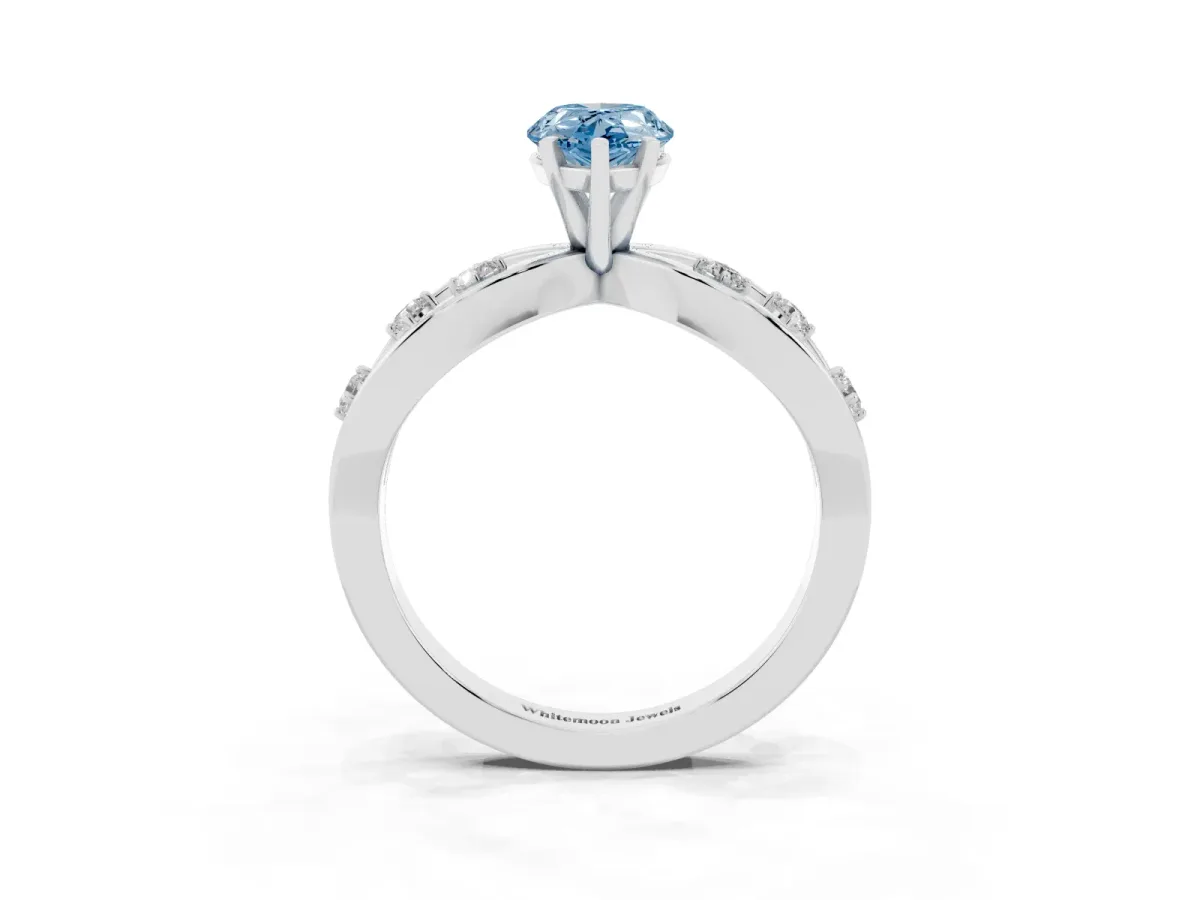 Fancy Blue Pear Cut Cut Solitaire Diamond with Side Stones on Criss-Cross Band and Four-Prong Setting Silver