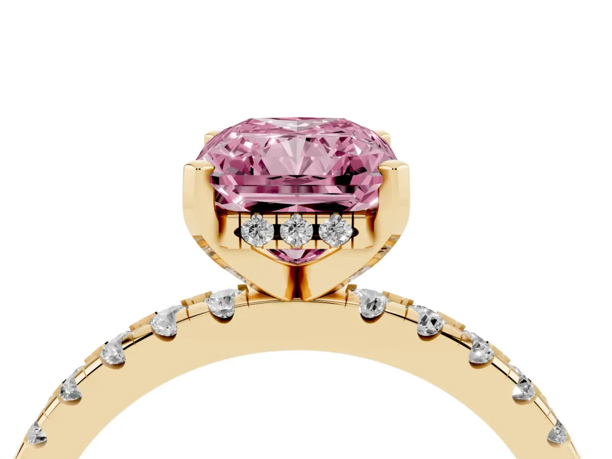 Fancy Pink Radiant Cut Diamond Solitaire Ring with Round Pavé Band and Four-Prong Setting Yellow gold