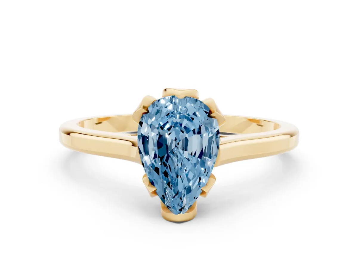 Fancy Blue Pear Cut Diamond Solitaire Ring with Flower Prong Setting and Classic Band Yellow gold