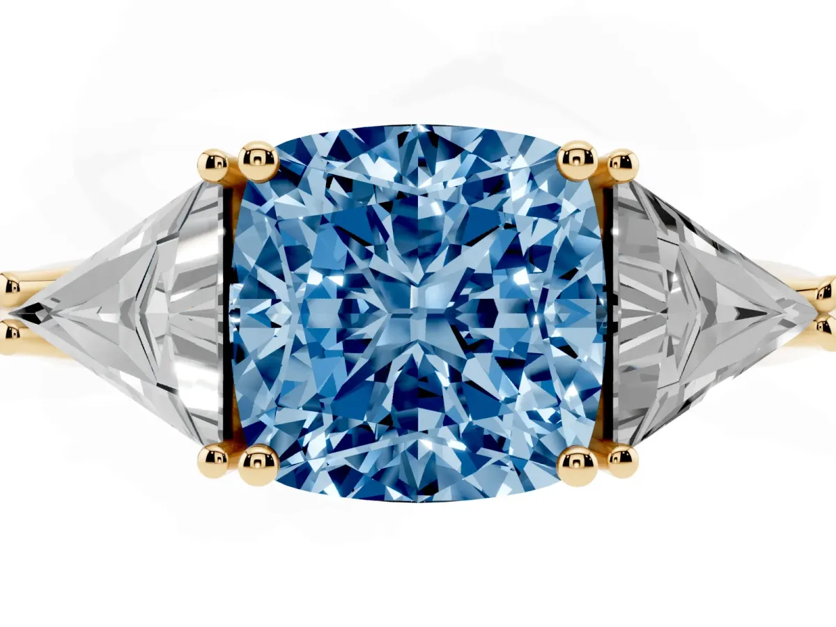 Fancy Blue Three-Stone Cushion Cut Diamond Engagement Ring with Trillion Side Stones and Prong Setting Yellow gold